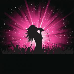 Silhouette of a female singer performing in front of a crowd.